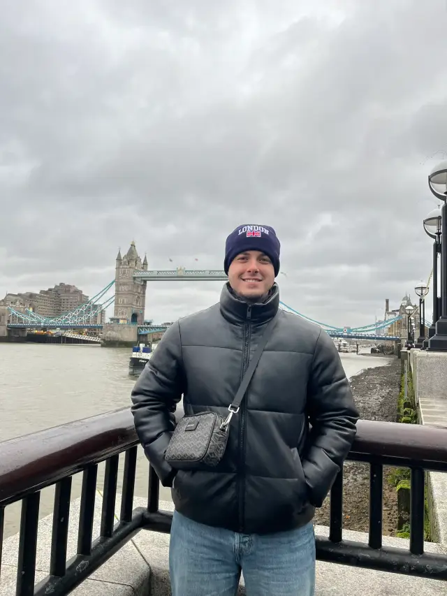 Standing by the Thames on a grey winter day, with Tower Bridge behind me.