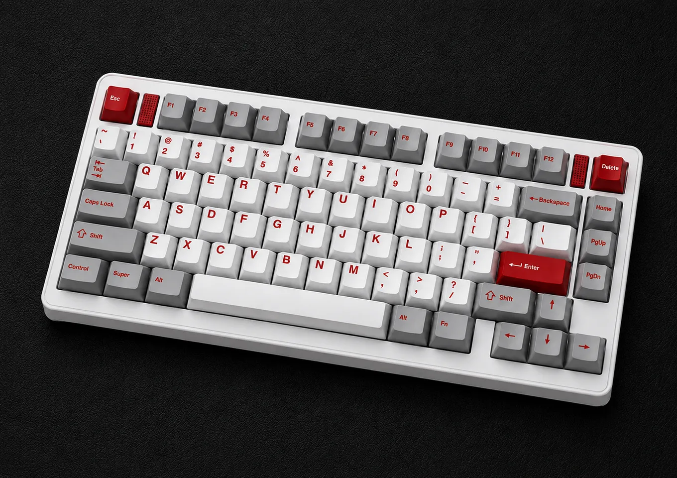 Three-quarter view of the assembled white EVO75 with white, grey and red keycaps on a black textured surface.